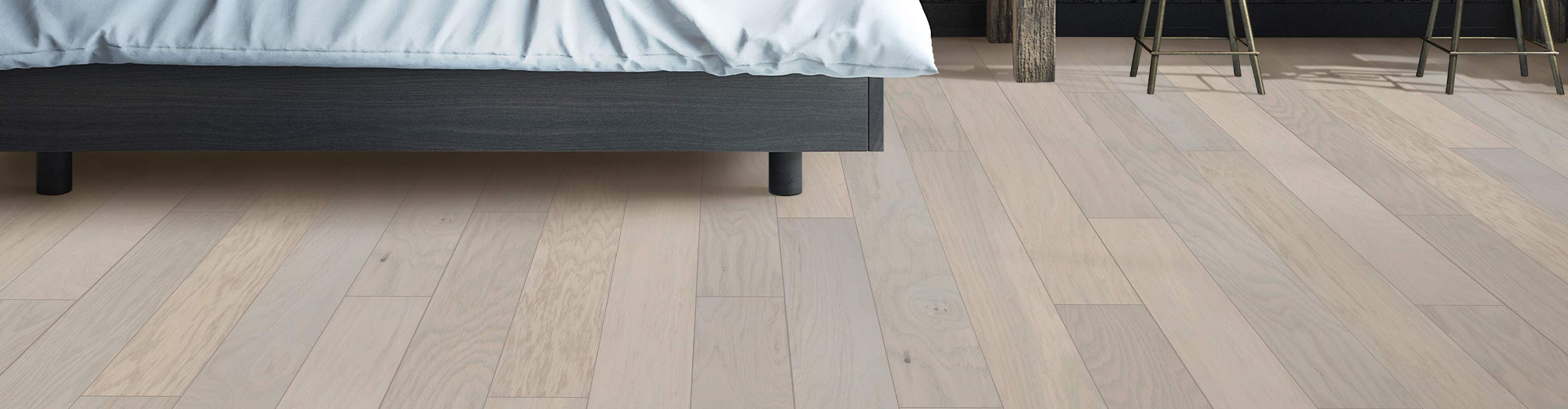 bedroom area with light hardwood floors